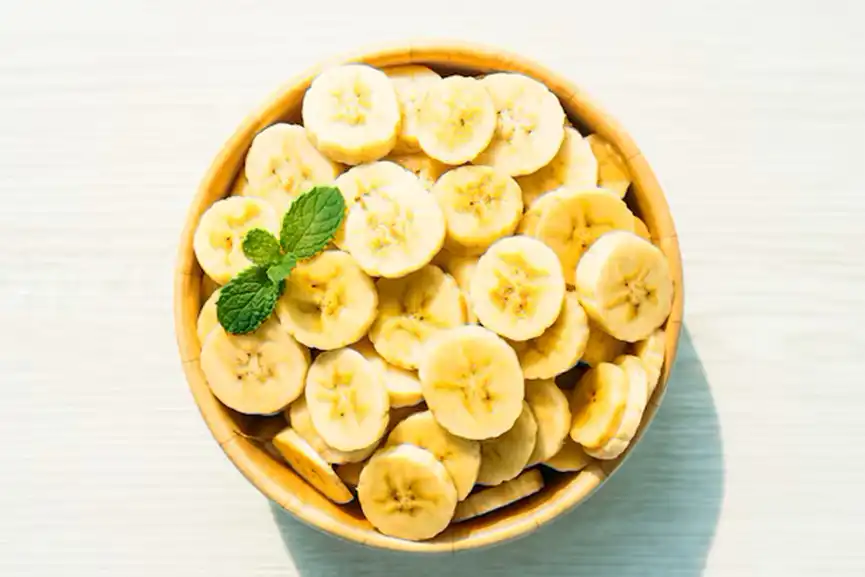 raw-yellow-banana-slices-wooden-bowl