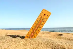 closeup-shot-thermometer-beach-sand