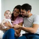 couple-playing-with-their-baby-girl