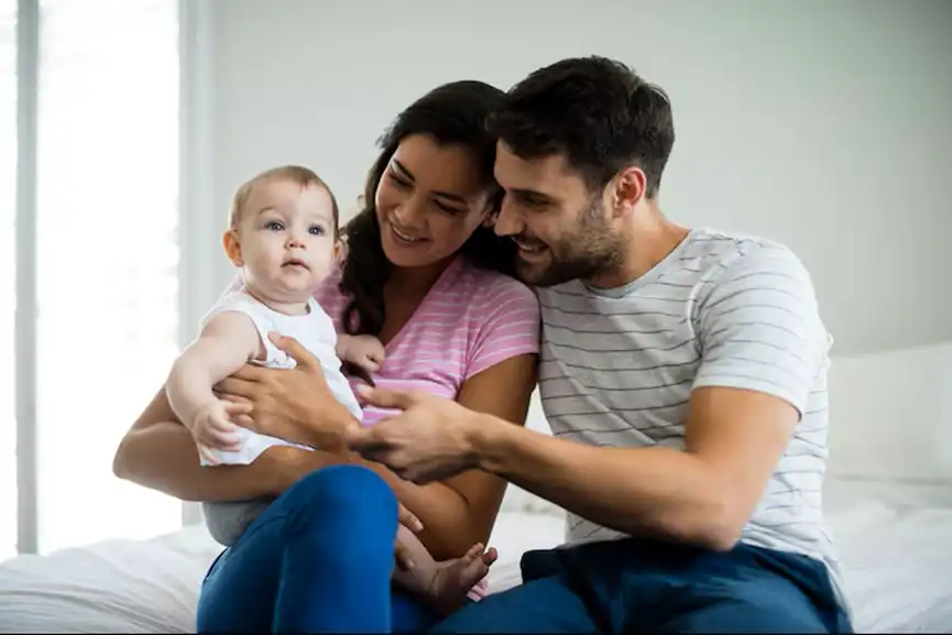 couple-playing-with-their-baby-girl