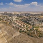 E1 SETTLEMENT