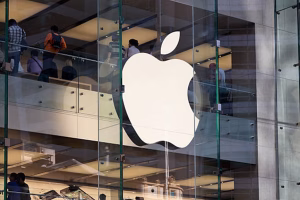 Apple Computers logo and shoppers at the Apple Store in Sydney