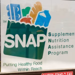 A Sign at a Retailer - We Accept SNAP IV