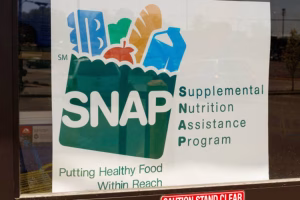 A Sign at a Retailer - We Accept SNAP IV