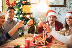 family-with-burning-bengal-fires-festive-table