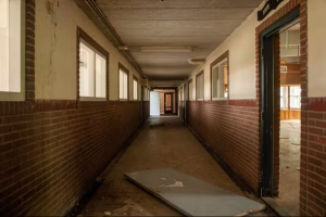 interior-shot-empty-hall-abandoned-school-with-broken-doors
