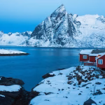 traditional-norwegian-wooden-house-rorbu-stand-shore-fjord-mountains-distance-lofoten-islands-norway-world-travel